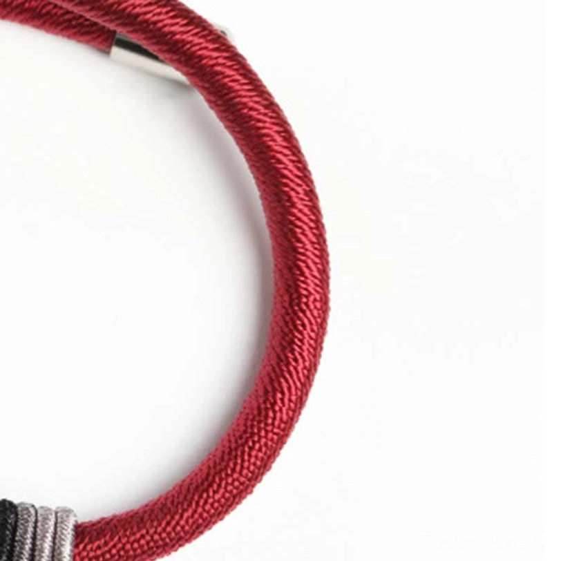 Full view Om Mani Padme Hum red sacred string bracelet with silver charm and layered thread wraps