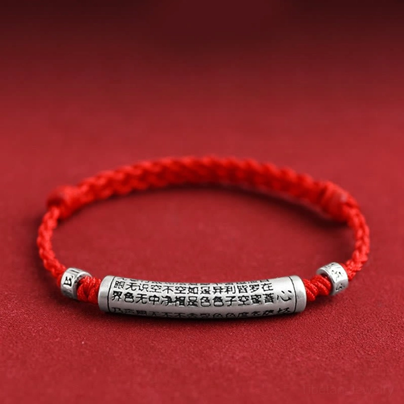 Handmade Om Mani Padme Hum bracelet with bright red braided rope and engraved Heart Sutra silver tube