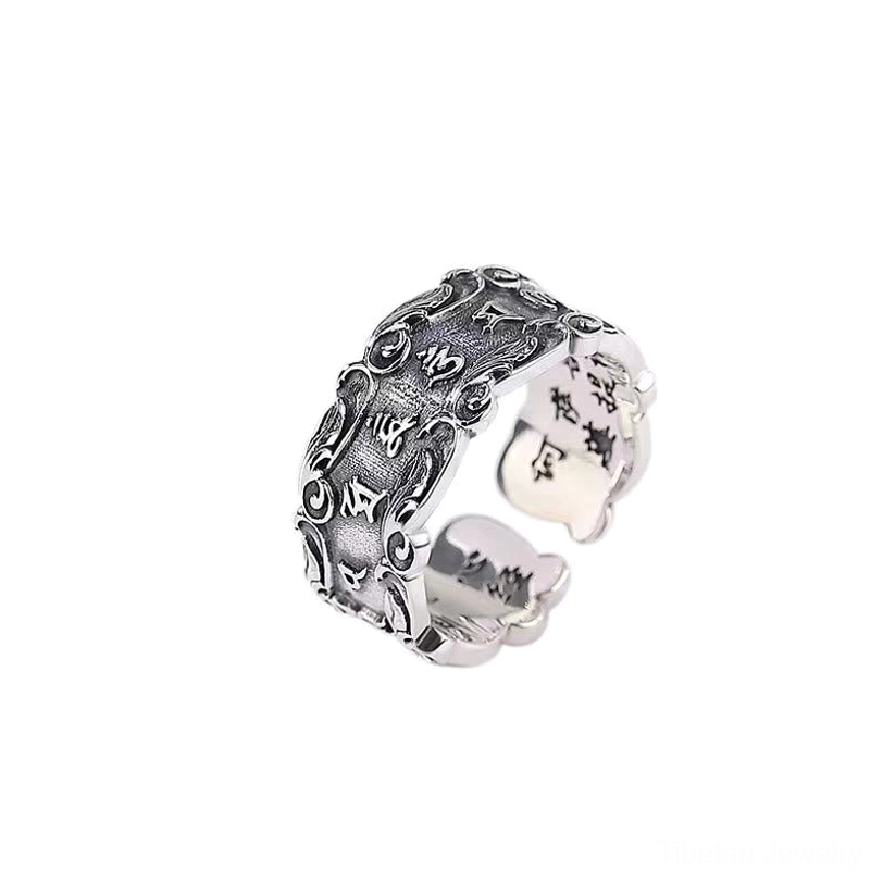 Sacred Sanskrit mantra adjustable ring, antique silver tone with exposed inner engraved characters and outer carved mantras, three-quarter view