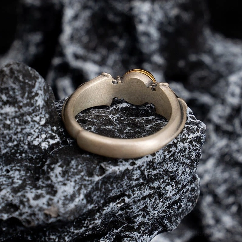 Inner back side view of 925 sterling silver Manjusri adjustable ring with matte polished finish on dark rock surface