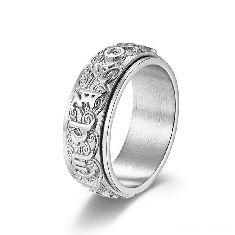 Pure silver titanium steel Om Mani Padme Hum spinner ring with carved Sanskrit and scroll patterns on white background