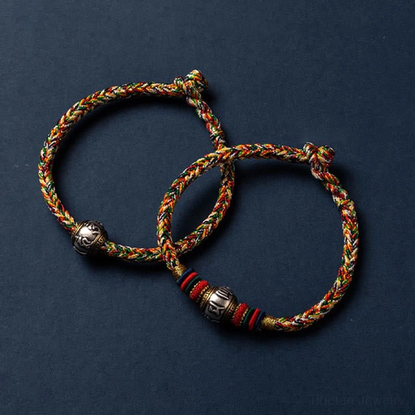 Om Mani Padme Hum Tibetan protection bracelet with sterling silver mantra charm close-up