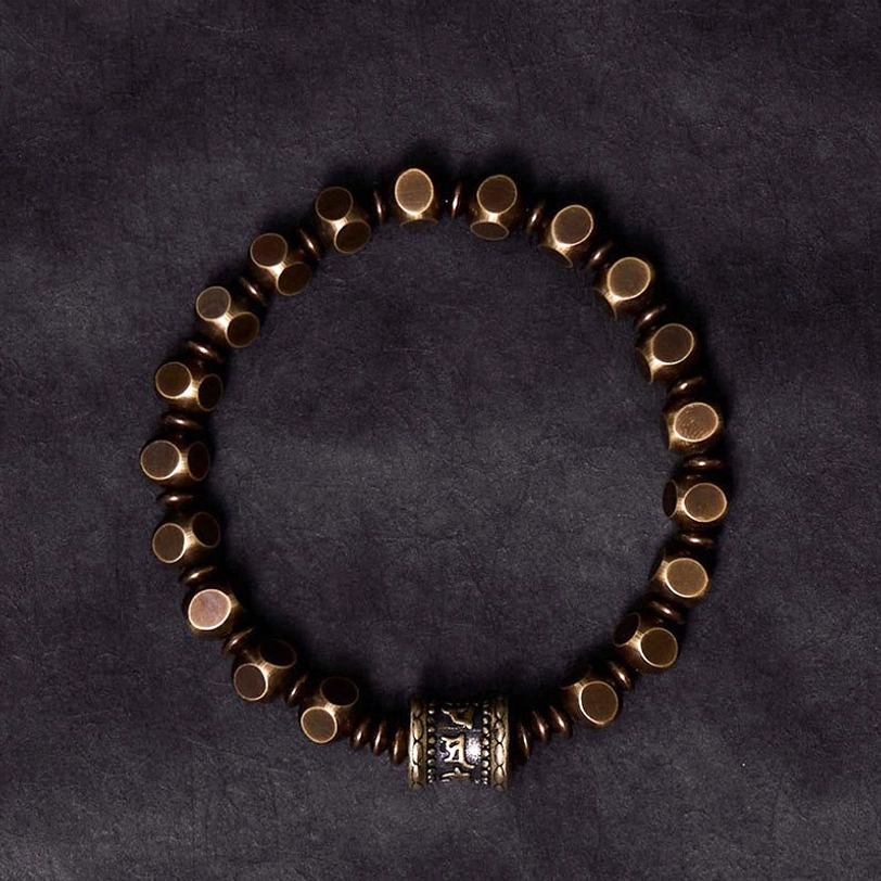 Handcrafted Om Mani Padme Hum stretch bracelet flat lay overhead view displaying full bead design