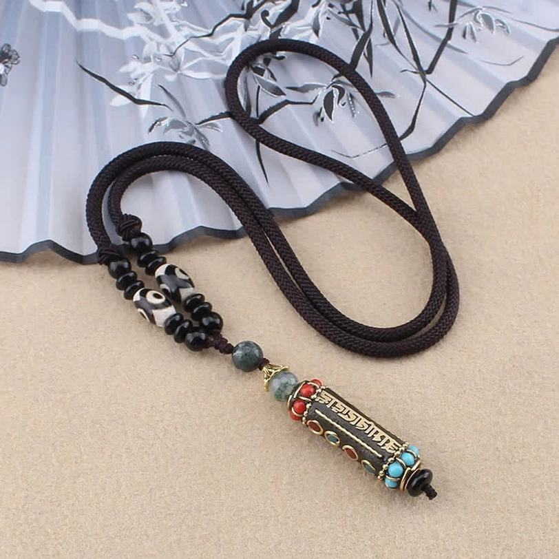 Tibetan Om Mani Padme Hum necklace with black nylon cord and minimal bead accents