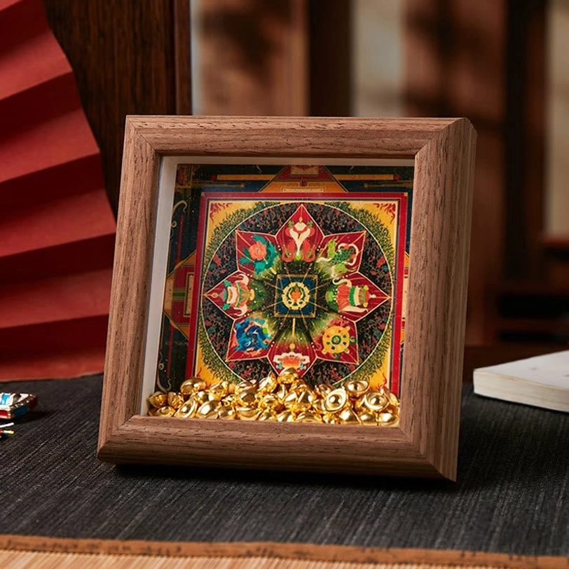 Tibetan thangka sacred art frame with hexagonal floral mandala and golden embellishments on dark brown wood finish