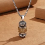 Om Mani Padme Hum Tibetan mantra pendant necklace front view with carved lotus and sutra details in silver-gold tone