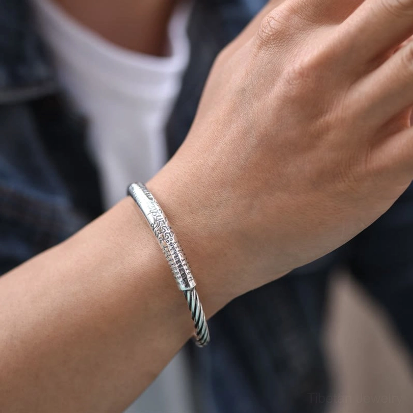 Om Mani Padme Hum copper bracelet detail showing twisted band craftsmanship