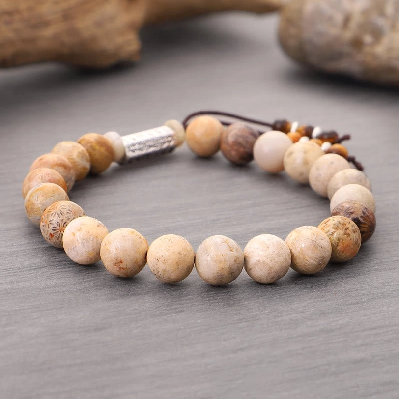 Om Mani Padme Hum bracelet with warm brown variegated stone beads, detailed view of authentic handcrafted quality