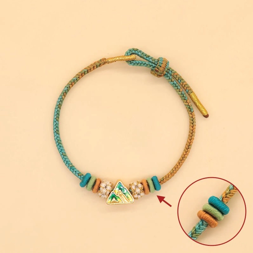 Tibetan eight-thread peace knot braided bracelet featuring peach blossom knot and multi-color handwoven design