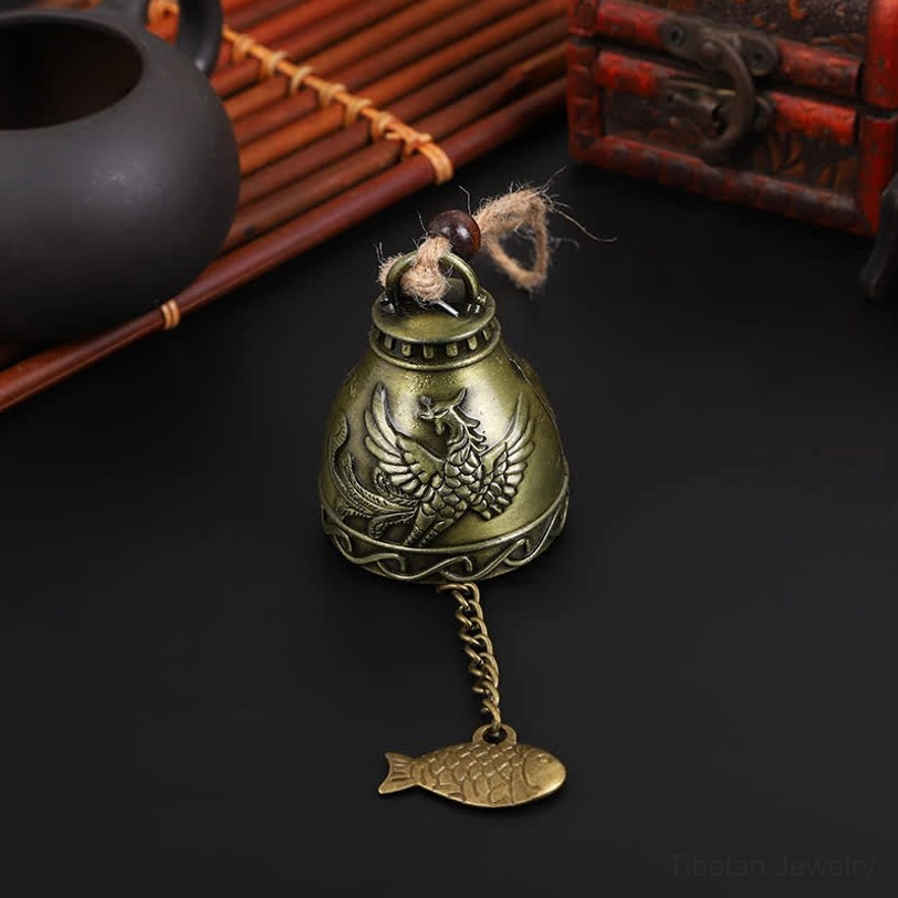 Phoenix symbol Tibetan wind chime bell with embossed rebirth design and traditional brass charm pendant