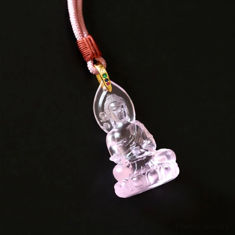 Pink Medicine Buddha necklace complete assembly on dark background, rose-toned Liuli crystal with full-length blue woven rope