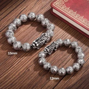 Two sizes of handmade Pixiu wealth bracelets comparison - 12mm and 15mm silver beads side by side