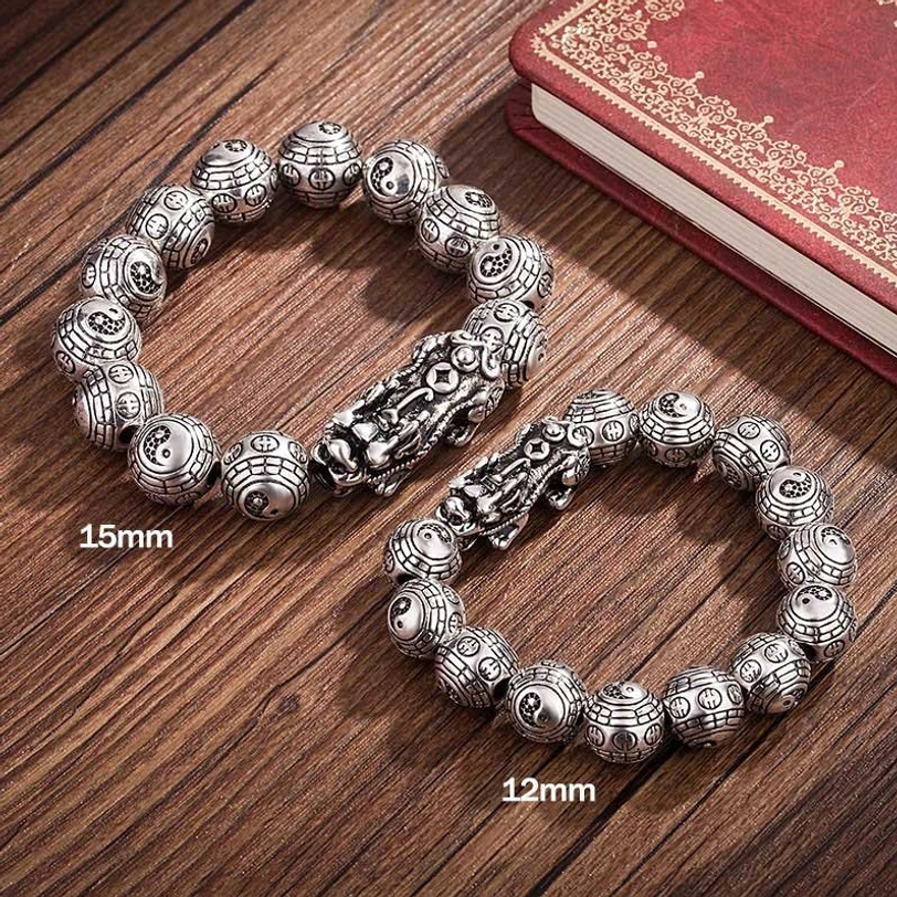 Two sizes of handmade Pixiu wealth bracelets comparison - 12mm and 15mm silver beads side by side