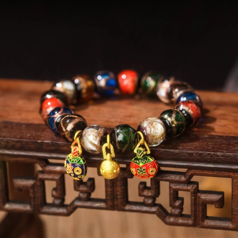 Alloy Gold Pixiu Family Charm bracelet featuring Liuli glass beads with alloy gold-toned Pixiu pendants in various bead sizes