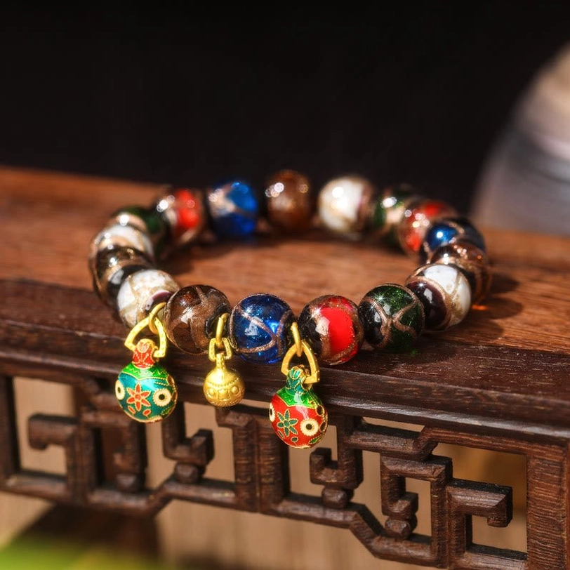 Copper Gold Pixiu Family Charm bracelet with Liuli glass beads in multiple sizes (10mm, 12mm, 14mm) showing detailed Pixiu pendant craftsmanship