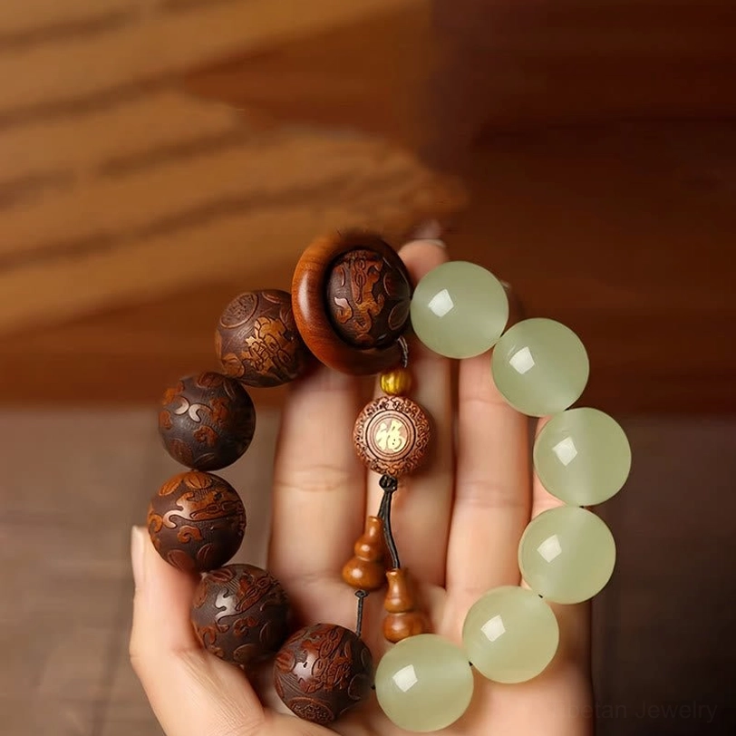 Sappan wood Pixiu Fu character bracelet top view with dark wood and green jade beads hand display