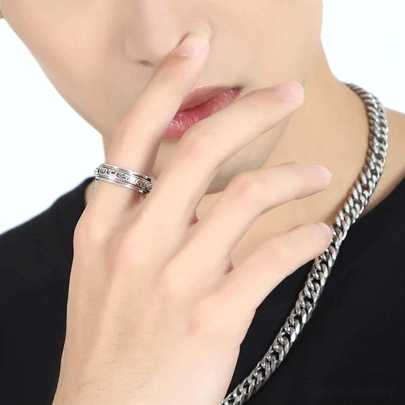 Tibetan Om Mani Padme Hum Pixiu ring worn on hand with silver chain necklace styling