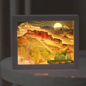 Potala Palace 3D paper carving LED table lamp with warm yellow light, front view showing intricate architectural details and layered design