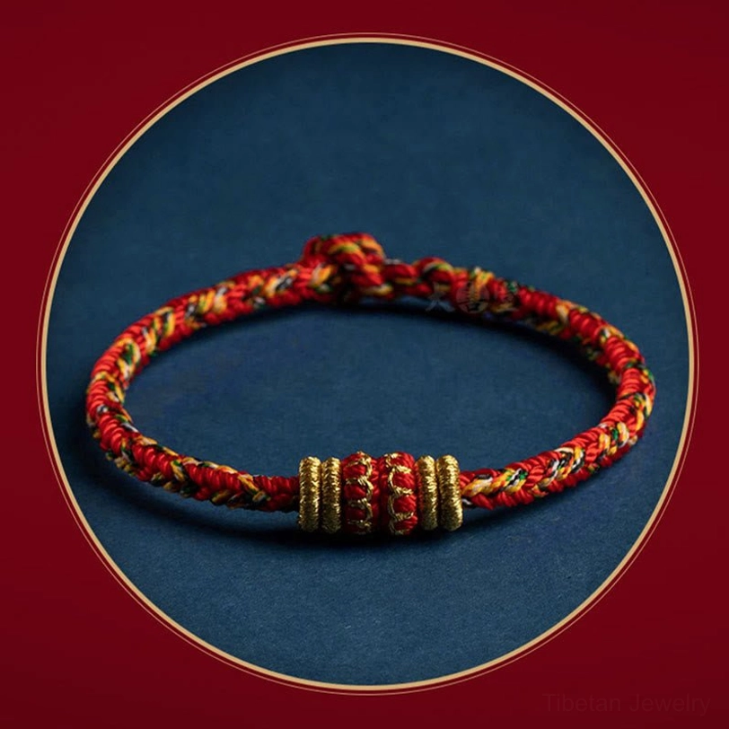 Protective red string tibetan zodiac bracelet with spiritual symbols and gold accents