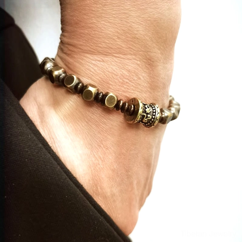 Pure brass meditation bracelet with sacred mantra carving representing Buddhist compassion and inner peace practice