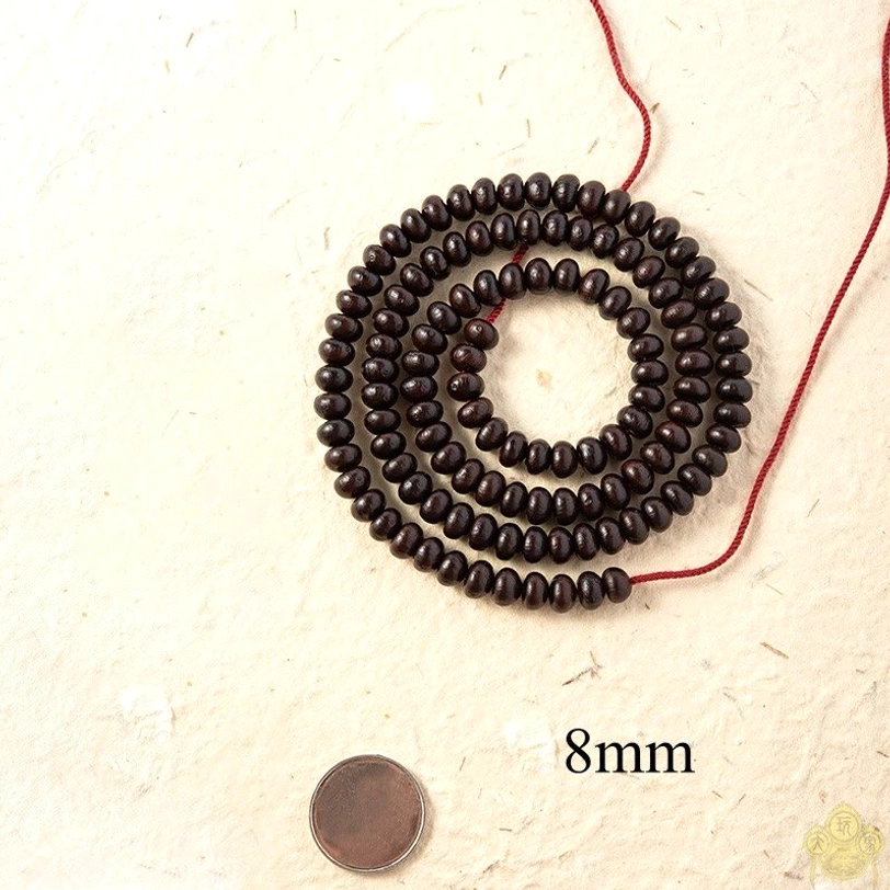 8mm Purple Bodhi Seed mala beads size comparison with coin and scale label showing larger bead variant