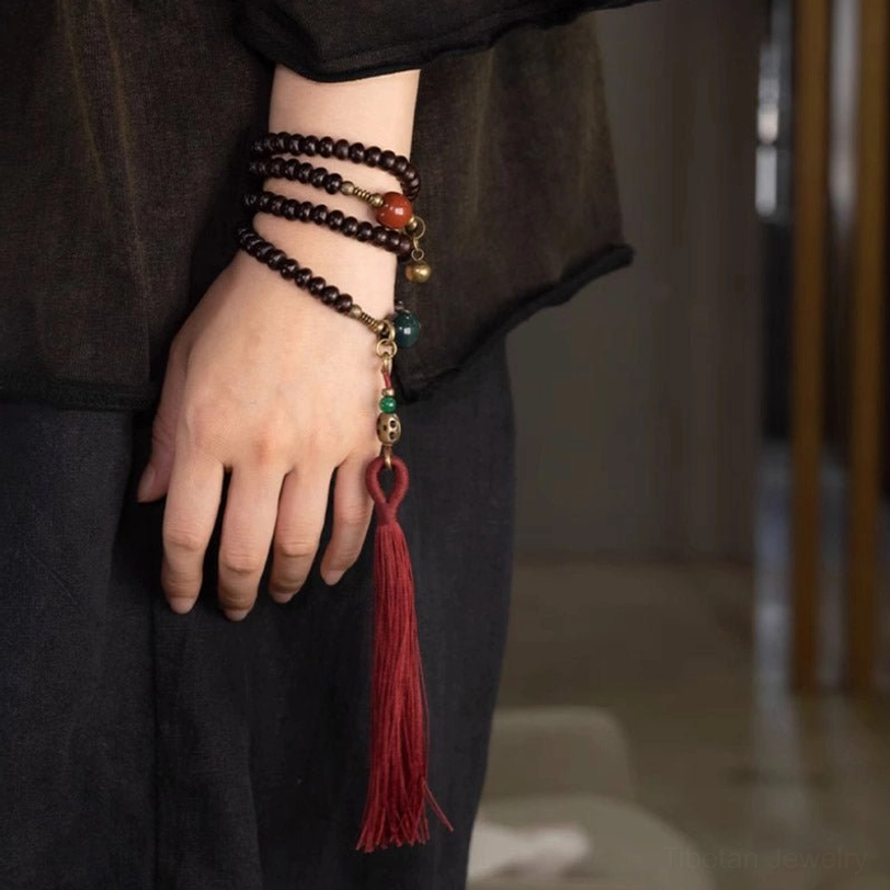 Multi-wrap purple bodhi mala bracelet on wrist showing comfortable fit and elegant appearance