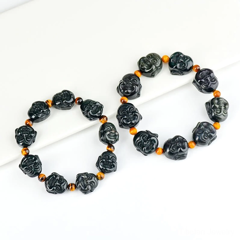 Rainbow obsidian bracelet close-up - natural stone beads with iridescent blue green purple bronze sheen and carved Buddha details