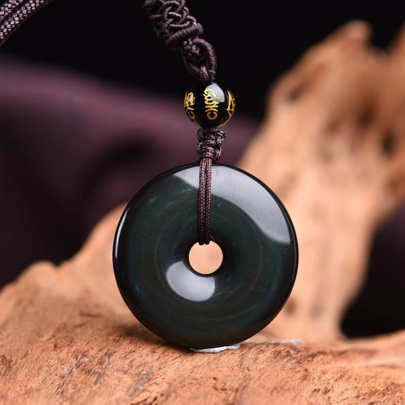 Rainbow obsidian necklace side angle showing hidden rainbow colors and handcrafted braided cord detail