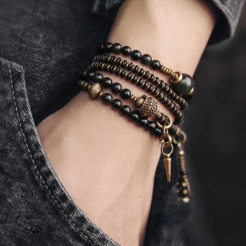 Rainbow obsidian multilayer spiritual bracelet showing complete bead arrangement with copper hardware accents
