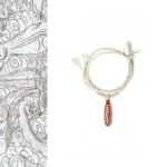 Red agate nine-eye dzi bead bracelet with braided hemp rope and decorative knots, front top view