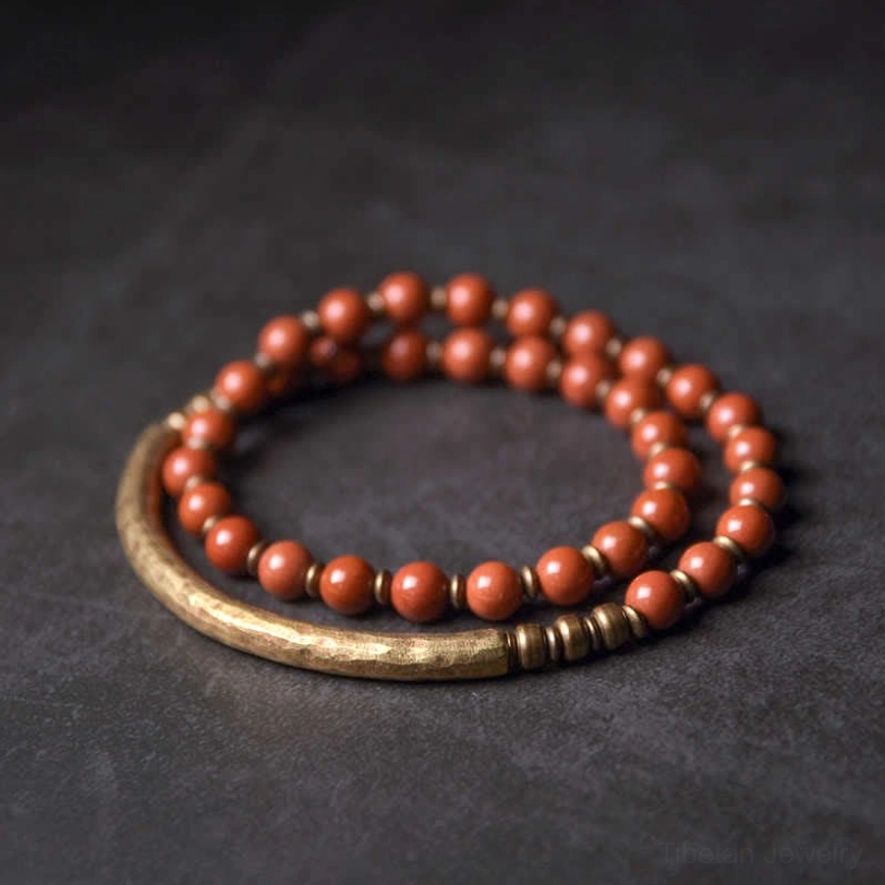 Double-strand red stone beads with simple copper ring healing bracelet - flat lay