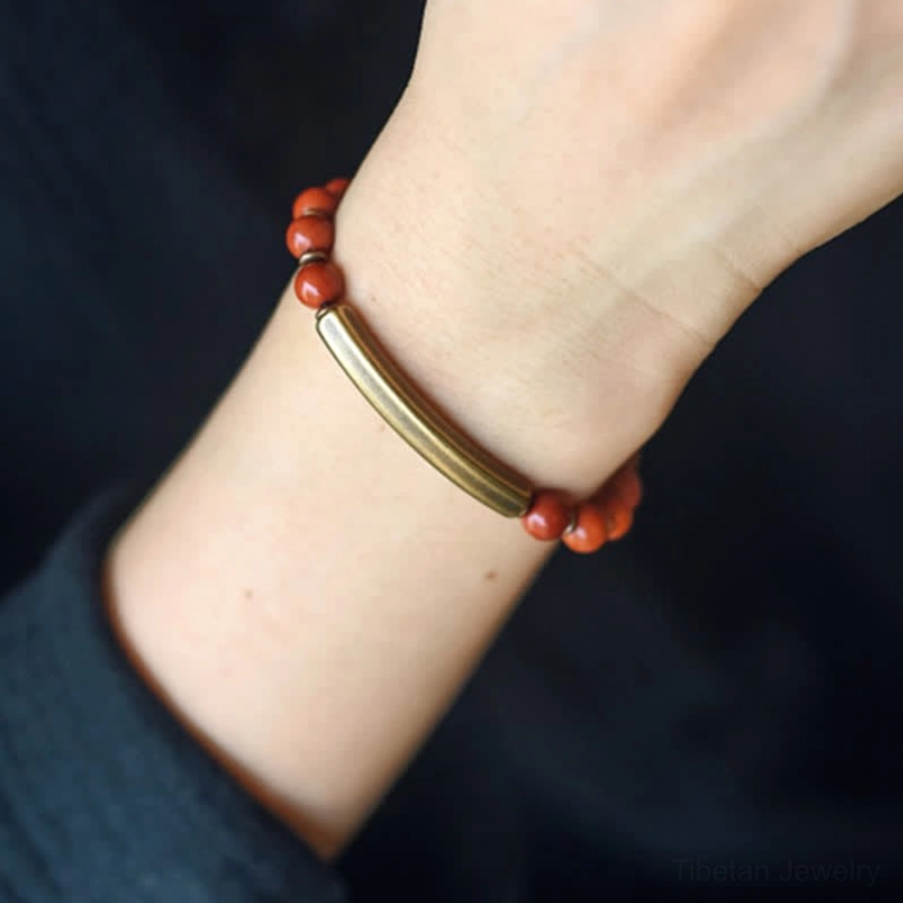 Red Jasper crystal healing bracelet worn on wrist - natural stone detail view