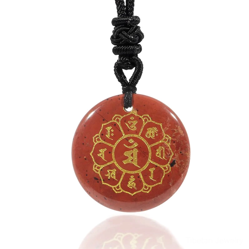 Red Stone Om Mani Padme Hum pendant with golden Sanskrit motif for strength and endurance