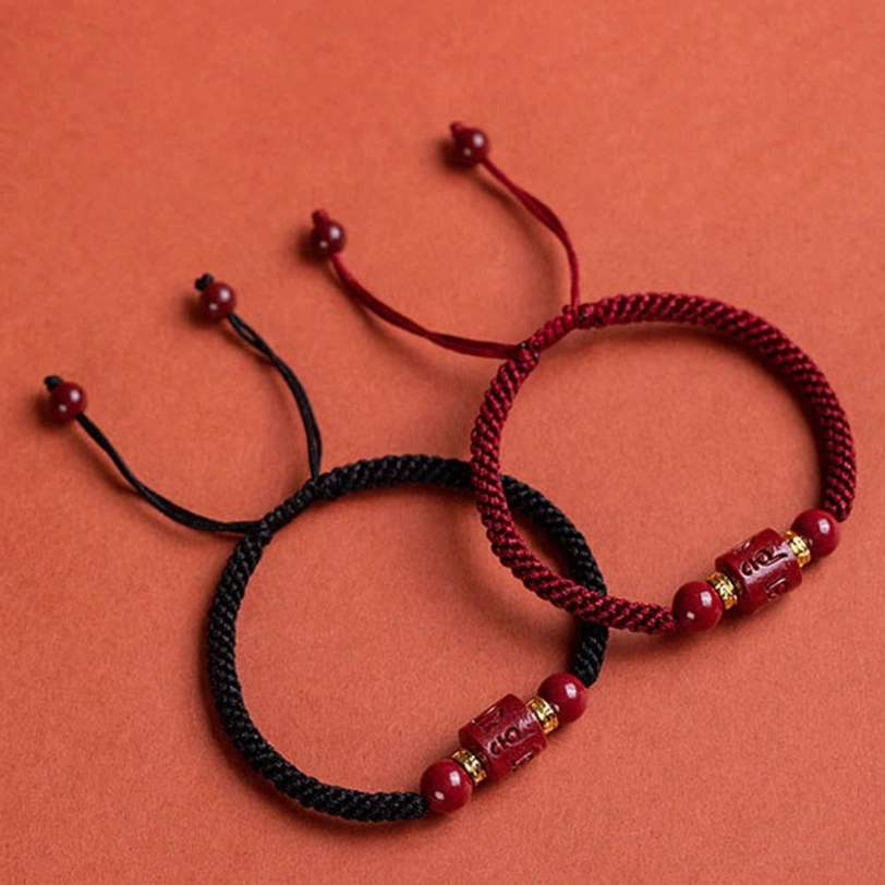Red string protection bracelet with cinnabar beads - traditional Tibetan Buddhist blessing and spiritual talisman