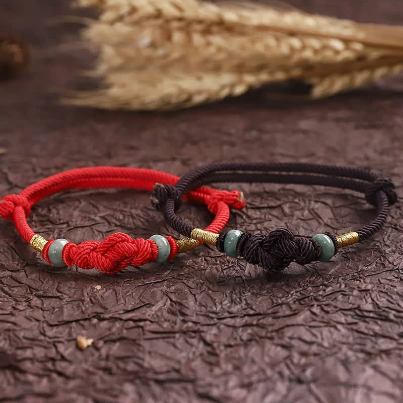Red string jade protection bracelet handmade with natural materials