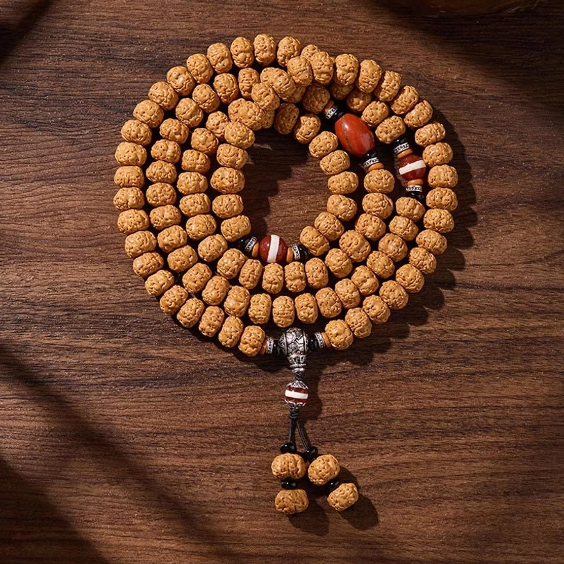 Rising sun three-eye dzi bodhi mala, representing spiritual awakening and enlightenment in Tibetan Buddhist meditation practice