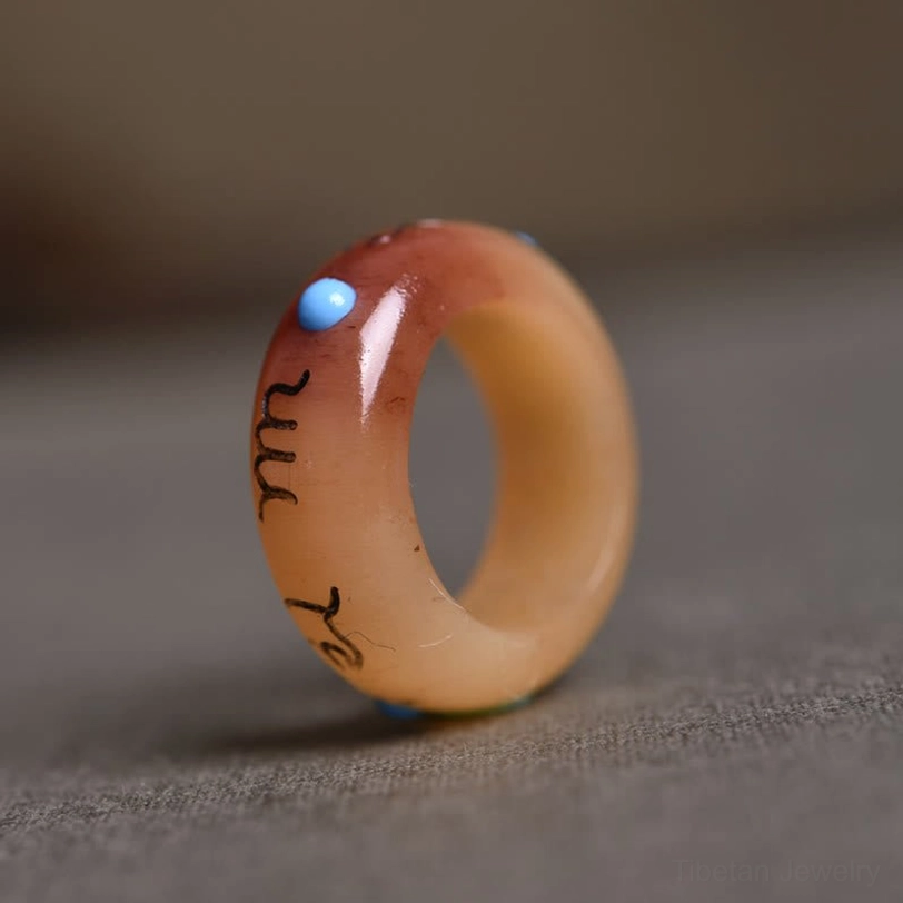 Round-style camel bone ring with continuous Om Mani Padme Hum mantra carved around full circumference, side profile view