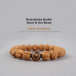 Rudraksha Bodhi Seed Dzi Bead bracelet top-down flat lay view with brown ridged seeds and central brown Dzi Bead on light gray background