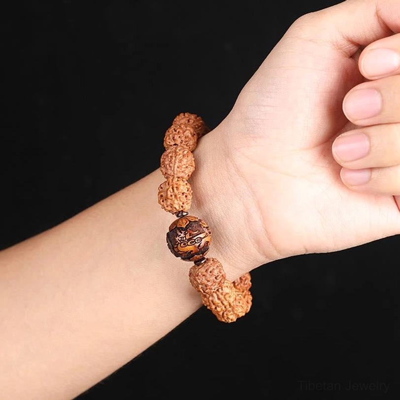 Rudraksha Pixiu Tibetan wealth bracelet detail shot showing individual bead texture and Pixiu carving craftsmanship