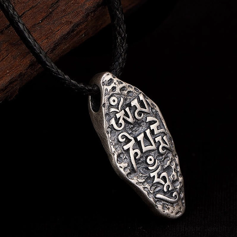 Tibetan silver Dorje pendant featuring sacred five-pronged Vajra symbol for spiritual strength and protection