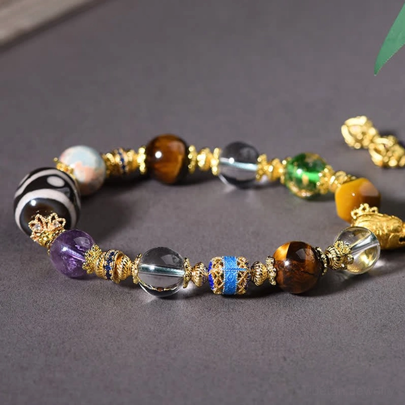 Hand-painted Dzi bead with geometric sacred patterns close-up detail