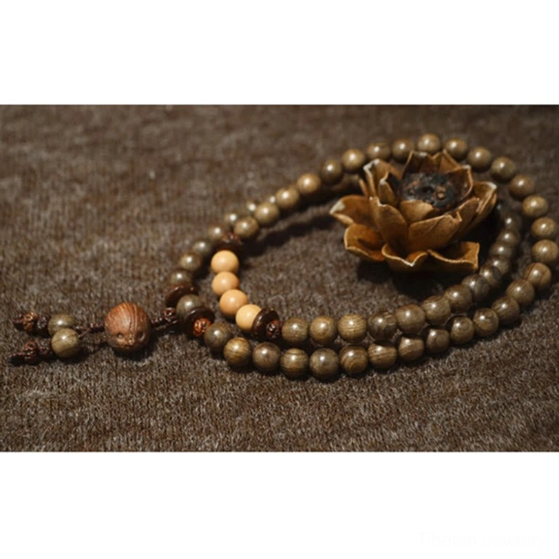 Handcrafted sandalwood prayer bead mala bracelet showcasing natural wood grain and artisan quality detail