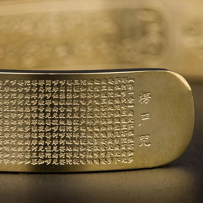Shurangama mantra engraved titanium steel cuff bracelet in gold tone - lifestyle product photography