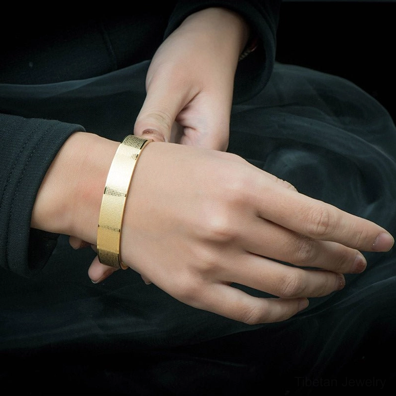 Shurangama mantra titanium steel bracelet worn on wrist - close-up side view demonstrating comfortable fit on casual clothing