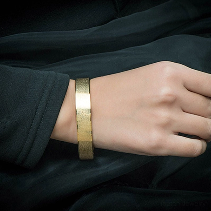 Shurangama mantra titanium steel bracelet on wrist showing proper fit with smooth polished band edges
