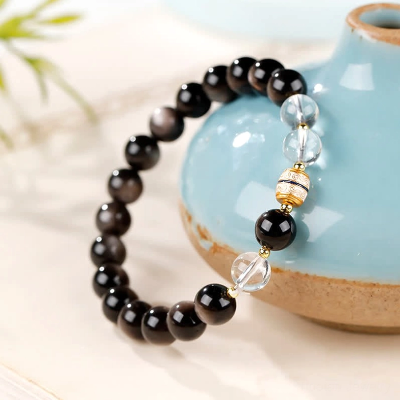 Silver Sheen Obsidian Dzi Bead Protection Bracelet side angle showing texture and bead arrangement