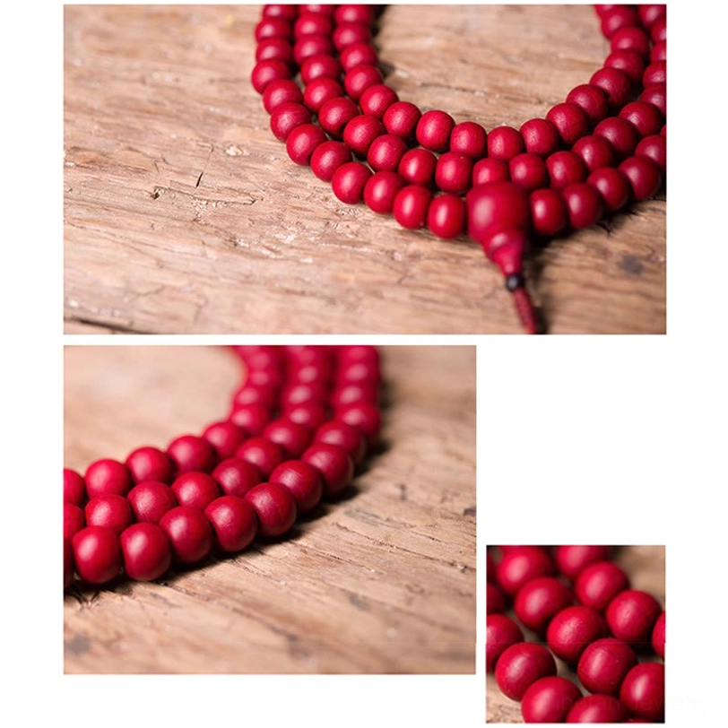 Single round abelia biflora wooden prayer bead front view showing matte red surface finish and central drilled hole for stringing