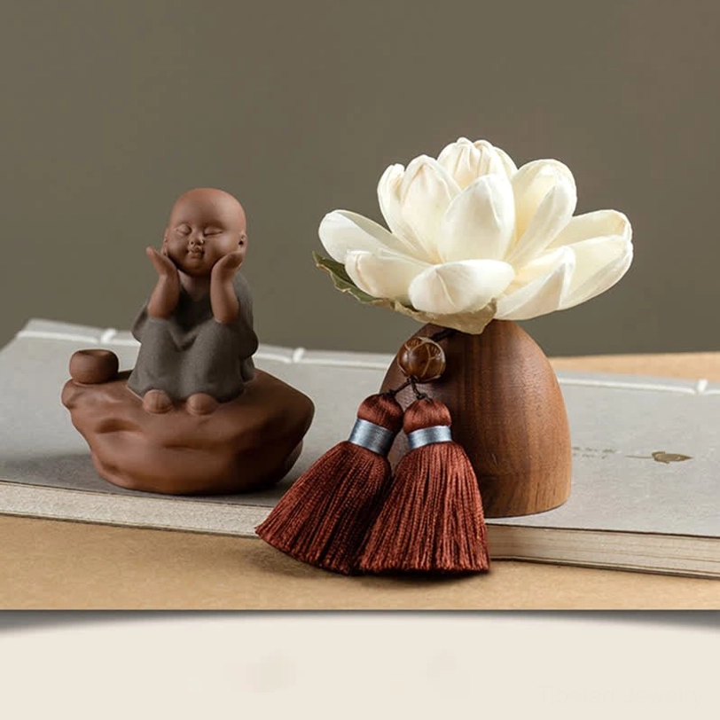 Seated little monk Buddha figurine in sitting meditation pose with lotus holder decoration