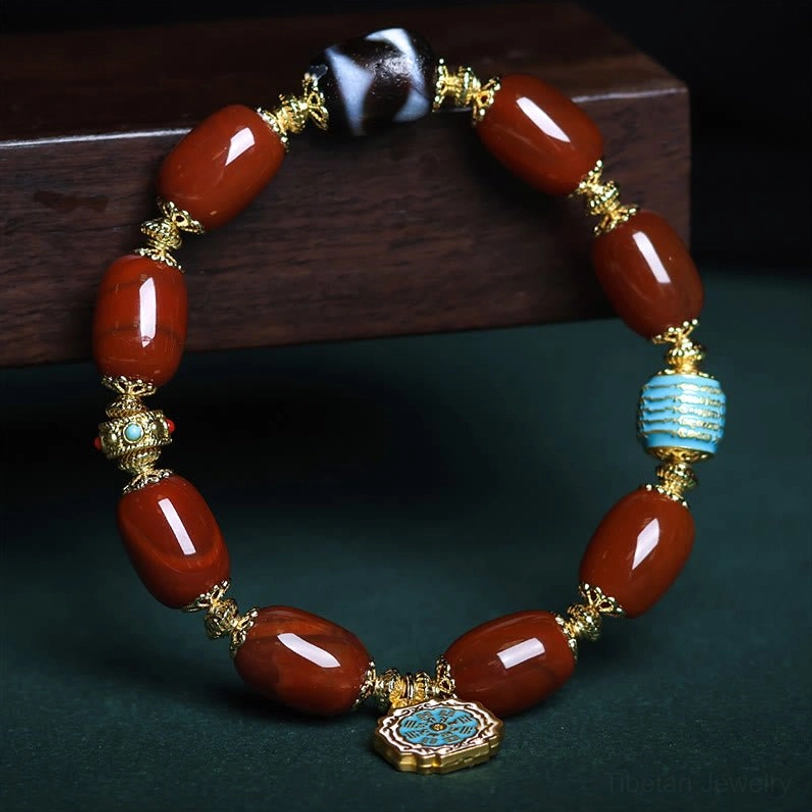 Overhead circular view of South Red Agate Bagua Dzi Bead Bracelet displaying full design with enamel Bagua pendant hanging below