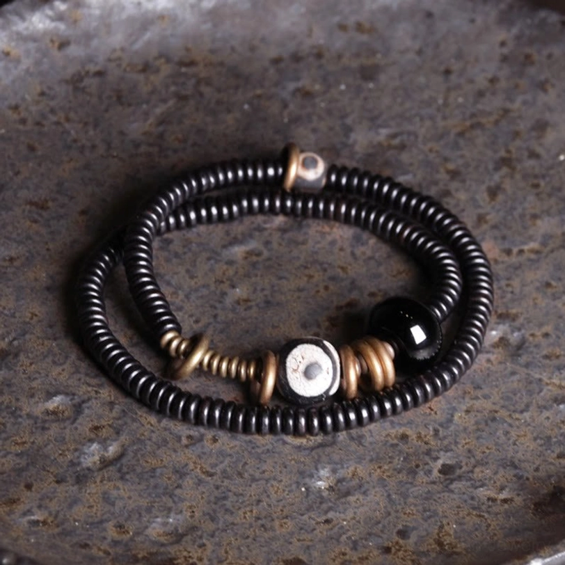 Spiritual grounding bracelet double wrap design with Dzi bead and natural wood materials